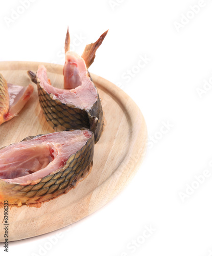 rawes  fish on wooden board backgrounde © indigolotos