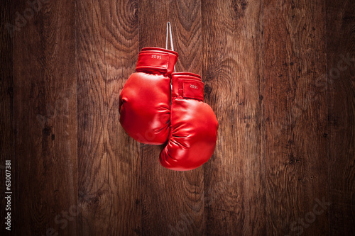 Pair of boxing gloves hanging on a wall