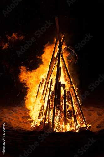 Photography A pyre burning in the night on a beach during summer holidays.