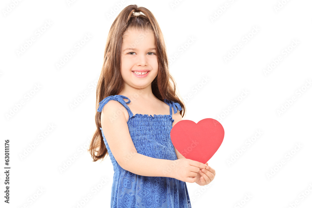 Little girl holding a red heart
