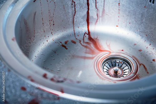 Close-up shot of bloody kitchen sink