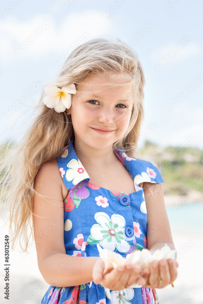 Young beautiful girl standing on beach Young beautiful girl standing on beach