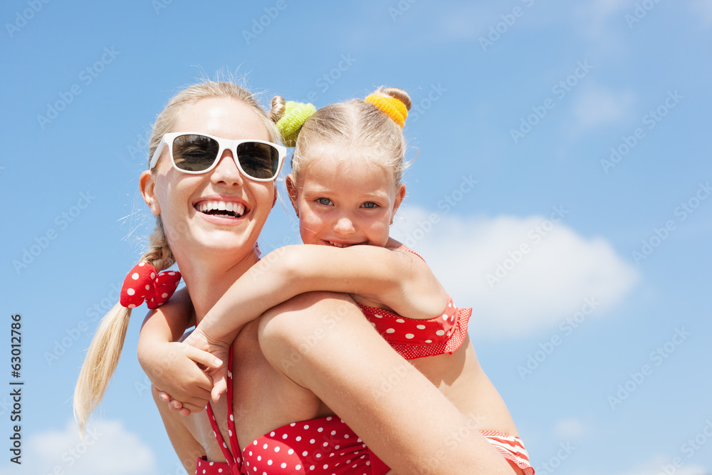 Happy family resting at beach in summer Happy family resting at beach in summer