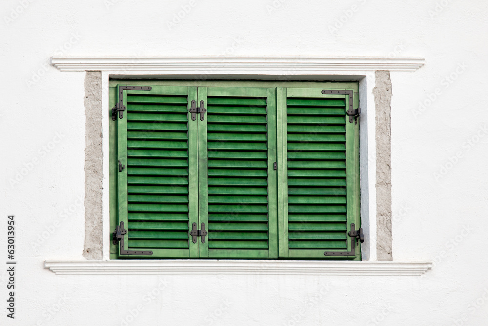 Vintage green window on white wall