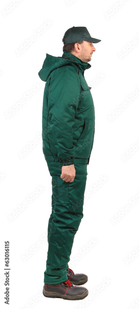 Worker in green overalls. Worker in green overalls.