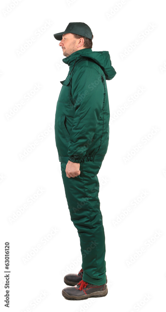 Worker in green overalls.