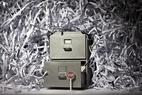 A file cabinet and lots of shredded paper.