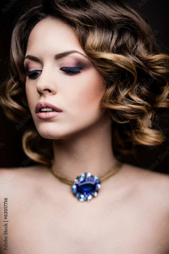 Beauty styled closeup portrait of a young woman