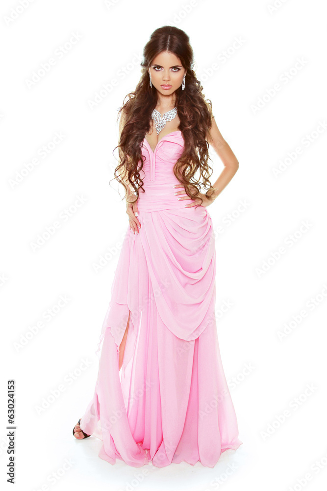 Beautiful brunette woman wearing in pink dress isolated on white