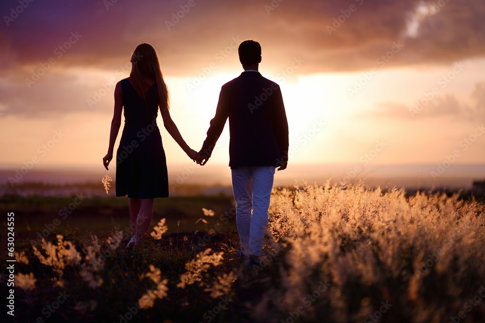 Young couple enjoying the sunset