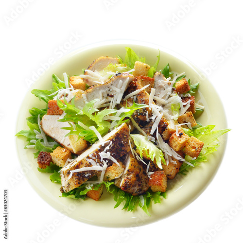 Caesar chicken salad on white background