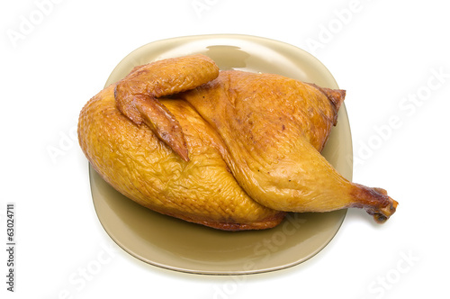 half smoked chicken carcass close up - white background.