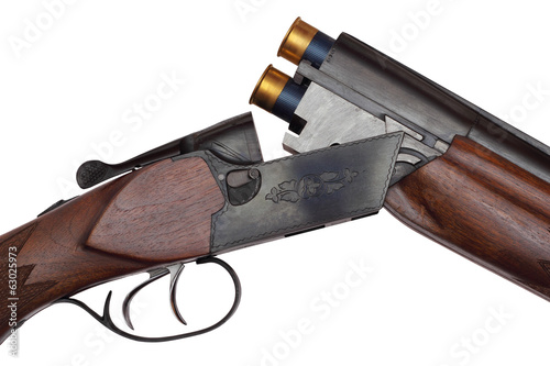 Opened double-barrelled hunting loaded gun closeup isolated