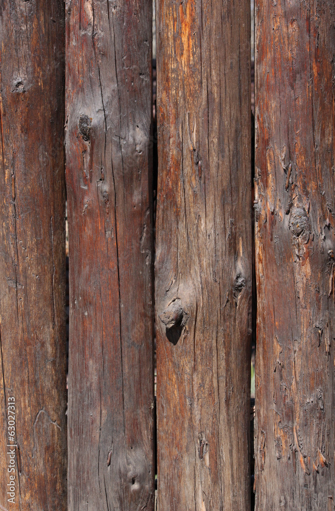 Obraz premium wooden fence made of logs