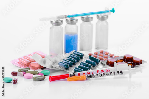 	pharmacology. vitamins and tablets with vials and syringes. iso