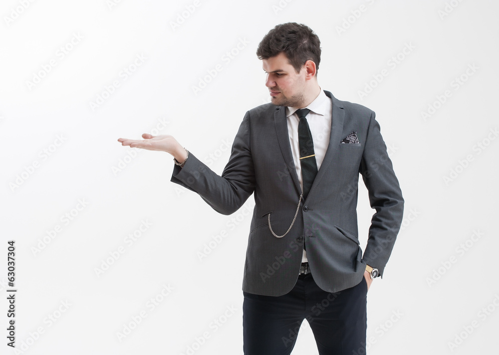 Handsome man makes a gesture with his hand. Handsome man makes a gesture with his hand.