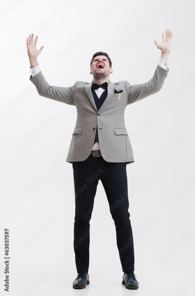 Businessman doing hand gestures. A man raises his hands up. Stock Photo