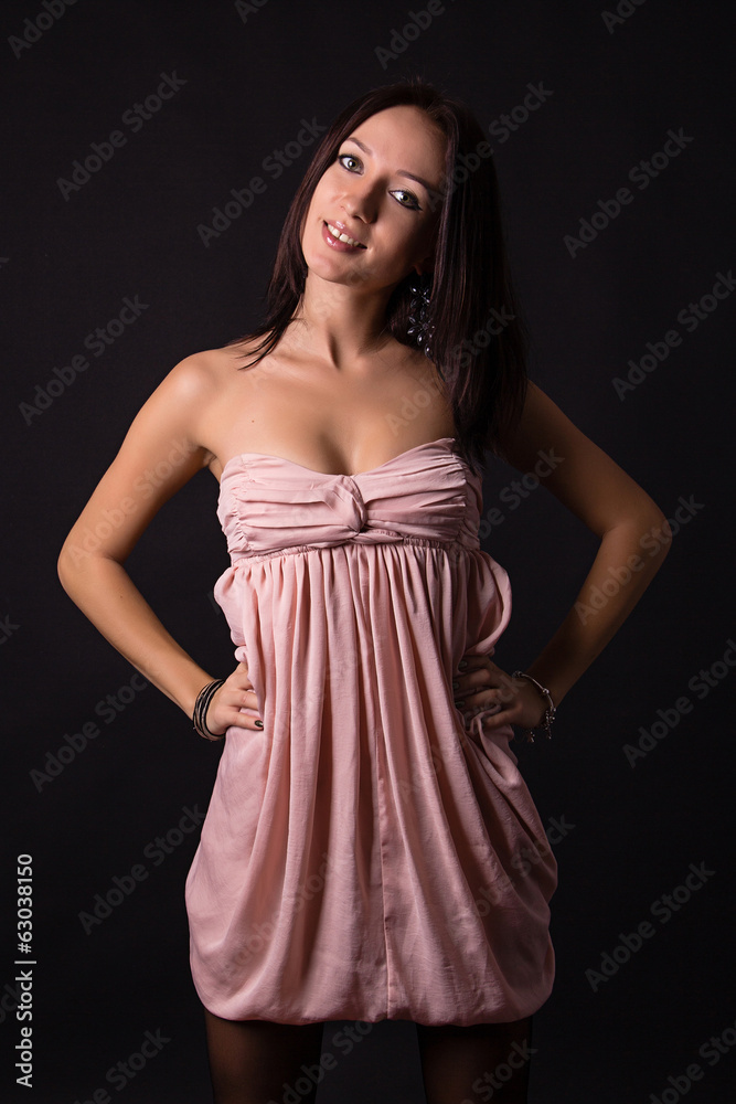 Fototapeta premium Sexy brunette woman posing in dress
