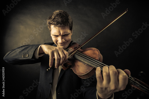 Man violinist playing violin. Classical music art
