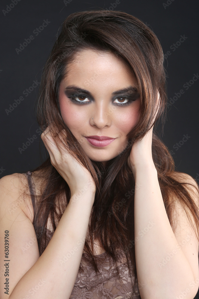 Sultry Young Woman on a Simple Background Sultry Young Woman on a Simple Background