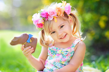 cute easter girl with chocolate bunny