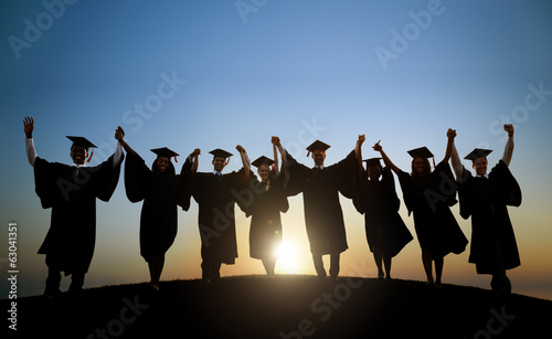 Graduating Students Celebrating At Sunset