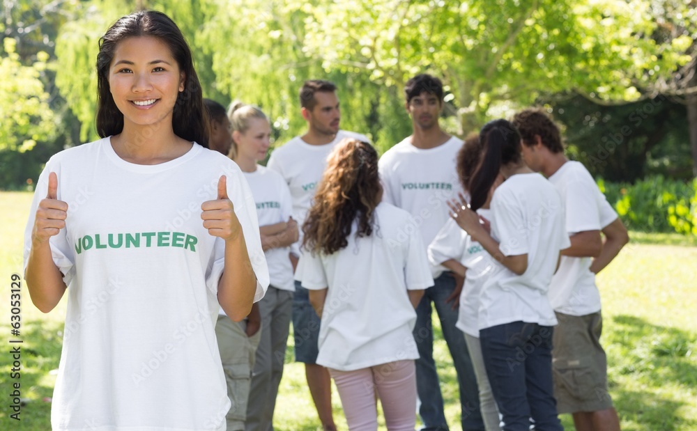 Confident volunteer gesturing thumbs up Confident volunteer gesturing thumbs up