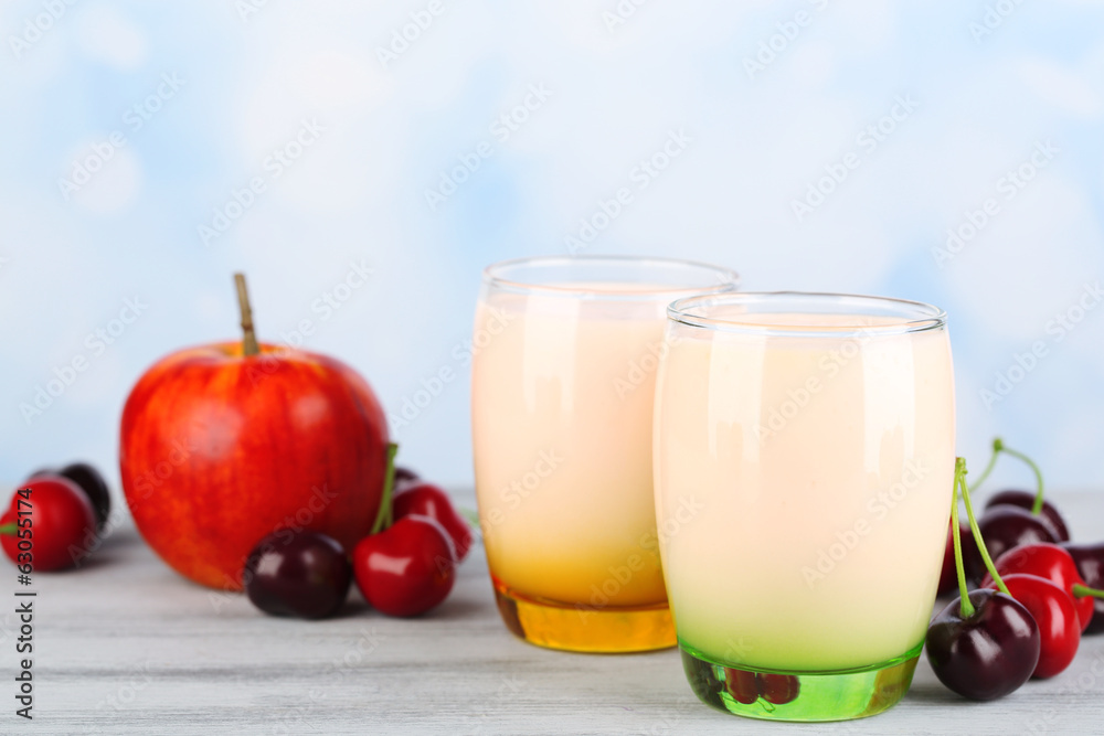 Delicious yogurt with fruits tastes in glasses and fresh fruits Delicious yogurt with fruits tastes in glasses and fresh fruits