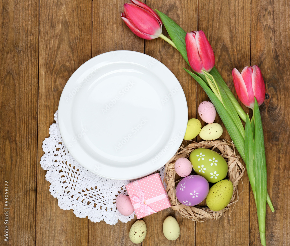 Easter table setting with tulips and eggs