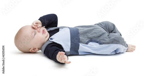 tired baby on floor isolated on white