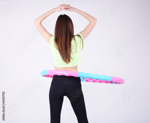 Woman doing exercises with ...