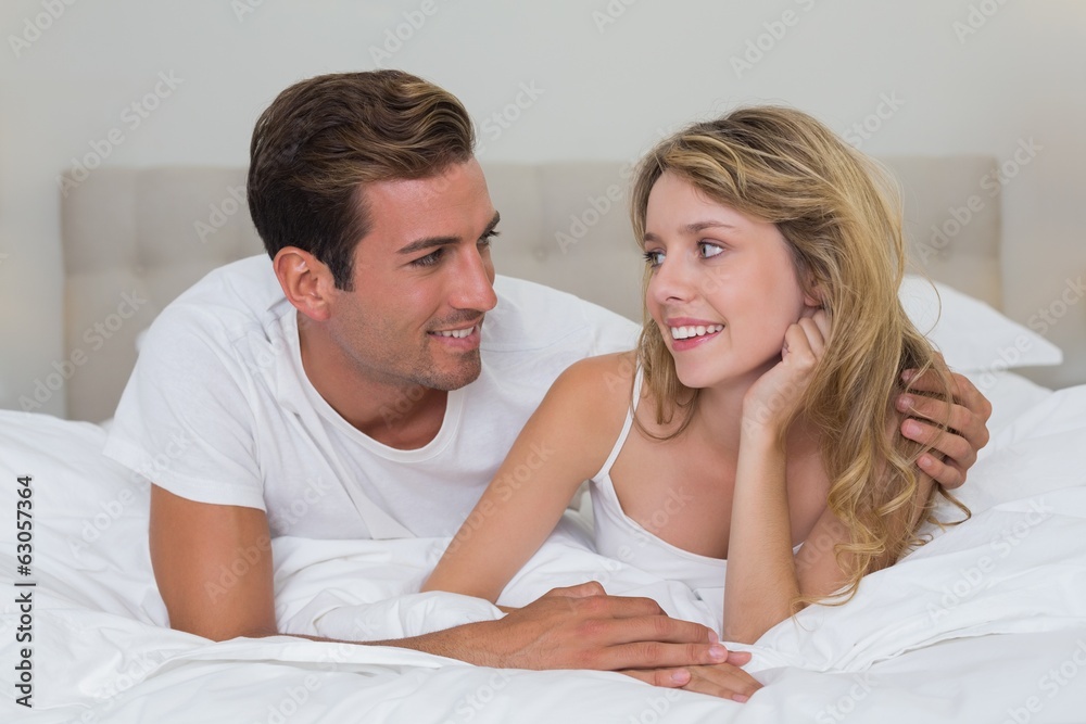Close-up of a loving couple lying in bed Close-up of a loving couple lying in bed