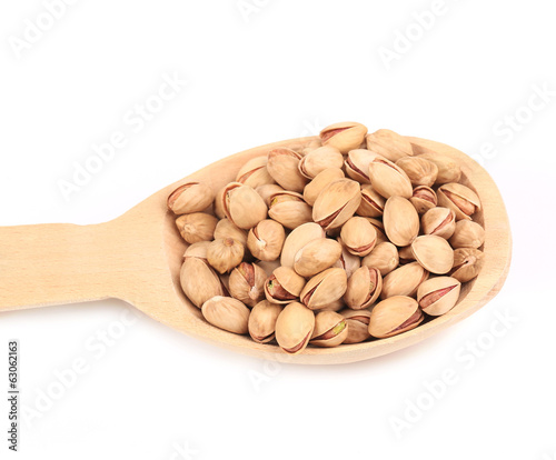 Wooden spoon with pistachios