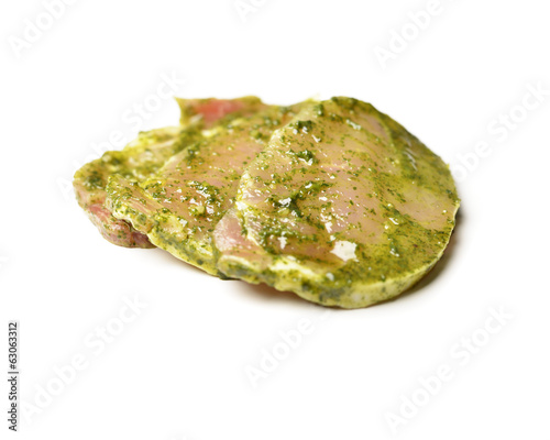 Raw marinated meat isolated on white.