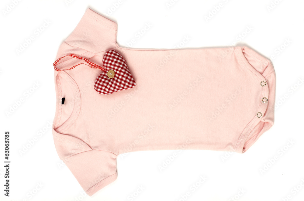 Close up of an pink baby bodysuit with a smal red heart on it Close up of an pink baby bodysuit with a smal red heart on it