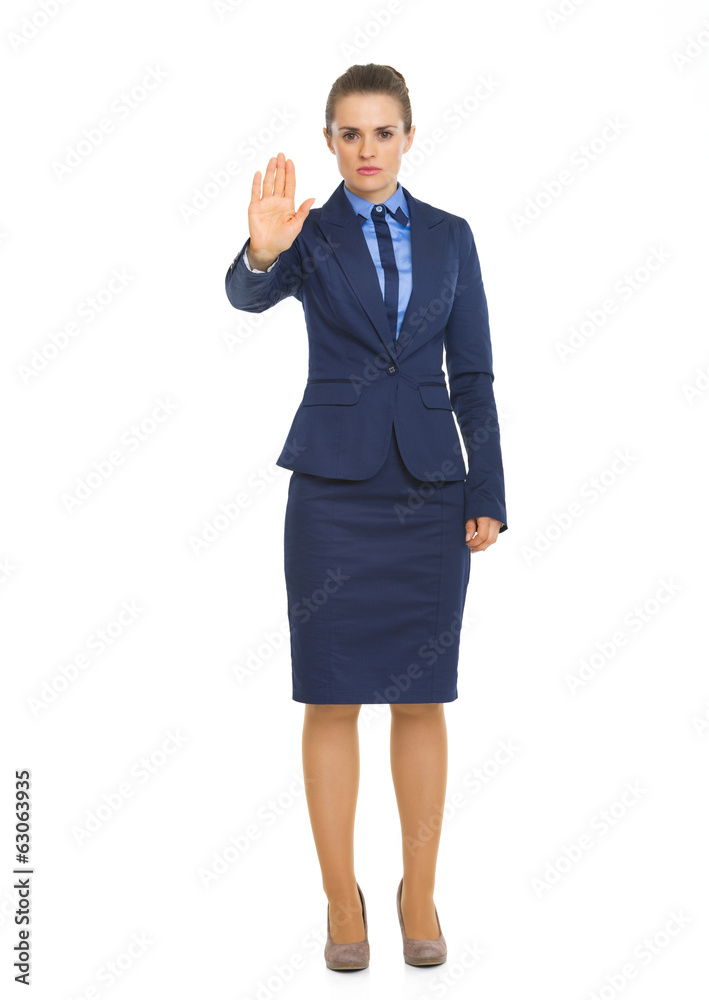 Full length portrait of business woman showing stop gesture Full length portrait of business woman showing stop gesture