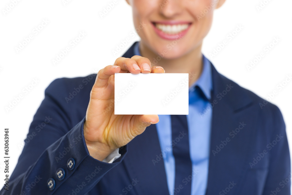 Closeup on happy business woman showing business card