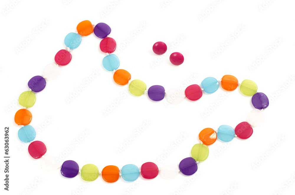 Close up with a necklace made from colorful pearls isolated Close up with a necklace made from colorful pearls isolated