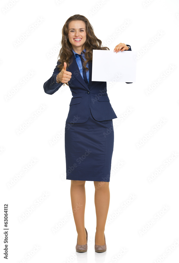Full length portrait of happy business woman showing blank paper Full length portrait of happy business woman showing blank paper