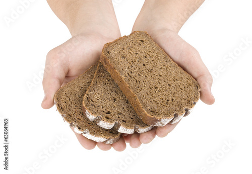 Hands hold a slice of bread isolated on white