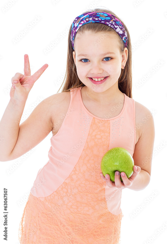 Charming little girl with green apple. Charming little girl with green apple.