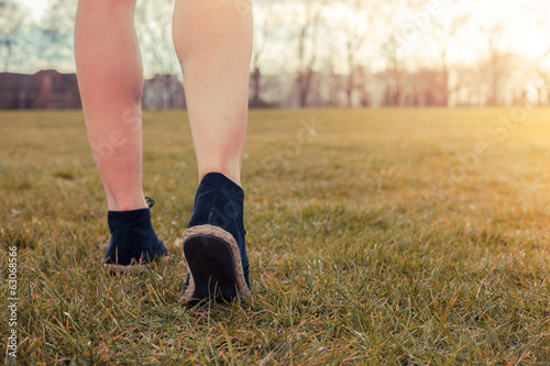 Young woman walking in the park