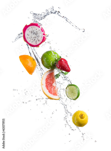 Pieces of exotic fruit in water splash