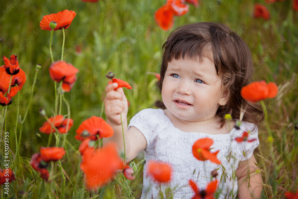 very happy child girl in poppy field very happy child girl in poppy field