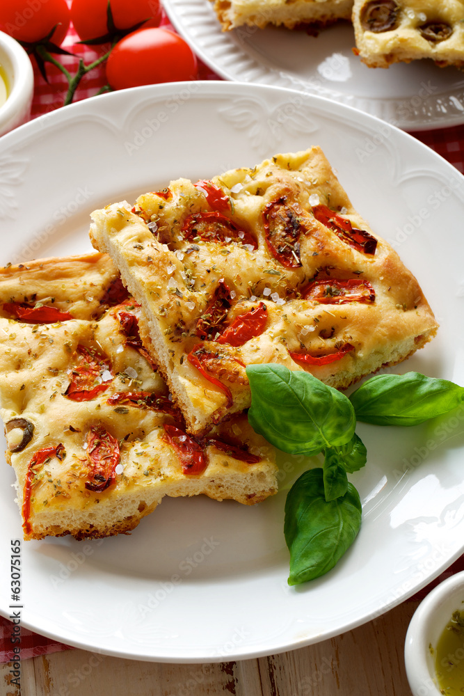Focaccia with tomatoes and oregano Focaccia with tomatoes and oregano