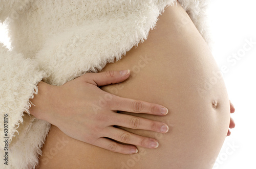 Close up on pregnant belly. Woman expecting a baby. photo