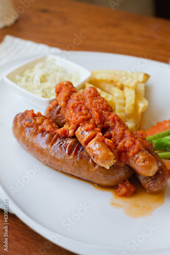 sausage platter with fried potato and vegetable