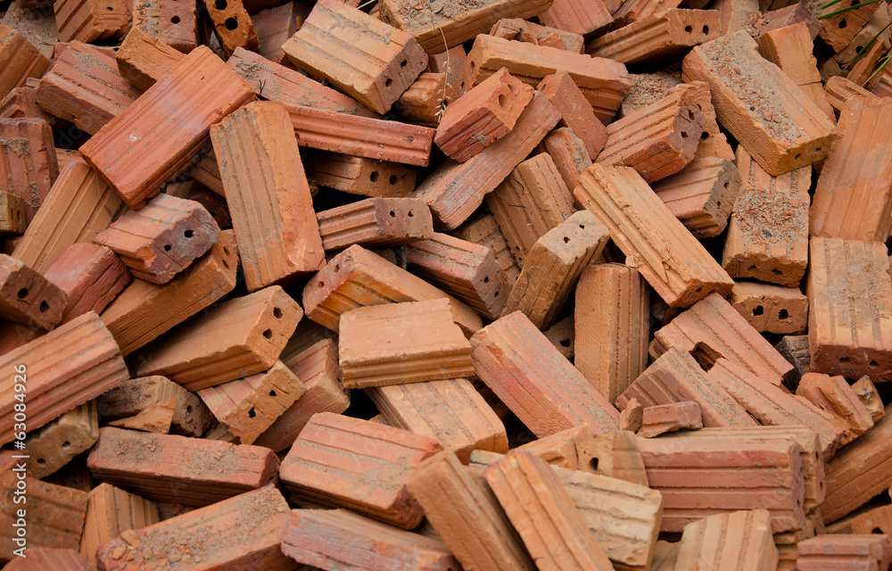 group of red bricks on construction site group of red bricks on construction site