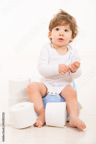 Amazed toddler boy on potty