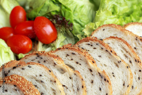 bread sprinkled with sesame -  vegetable green salad